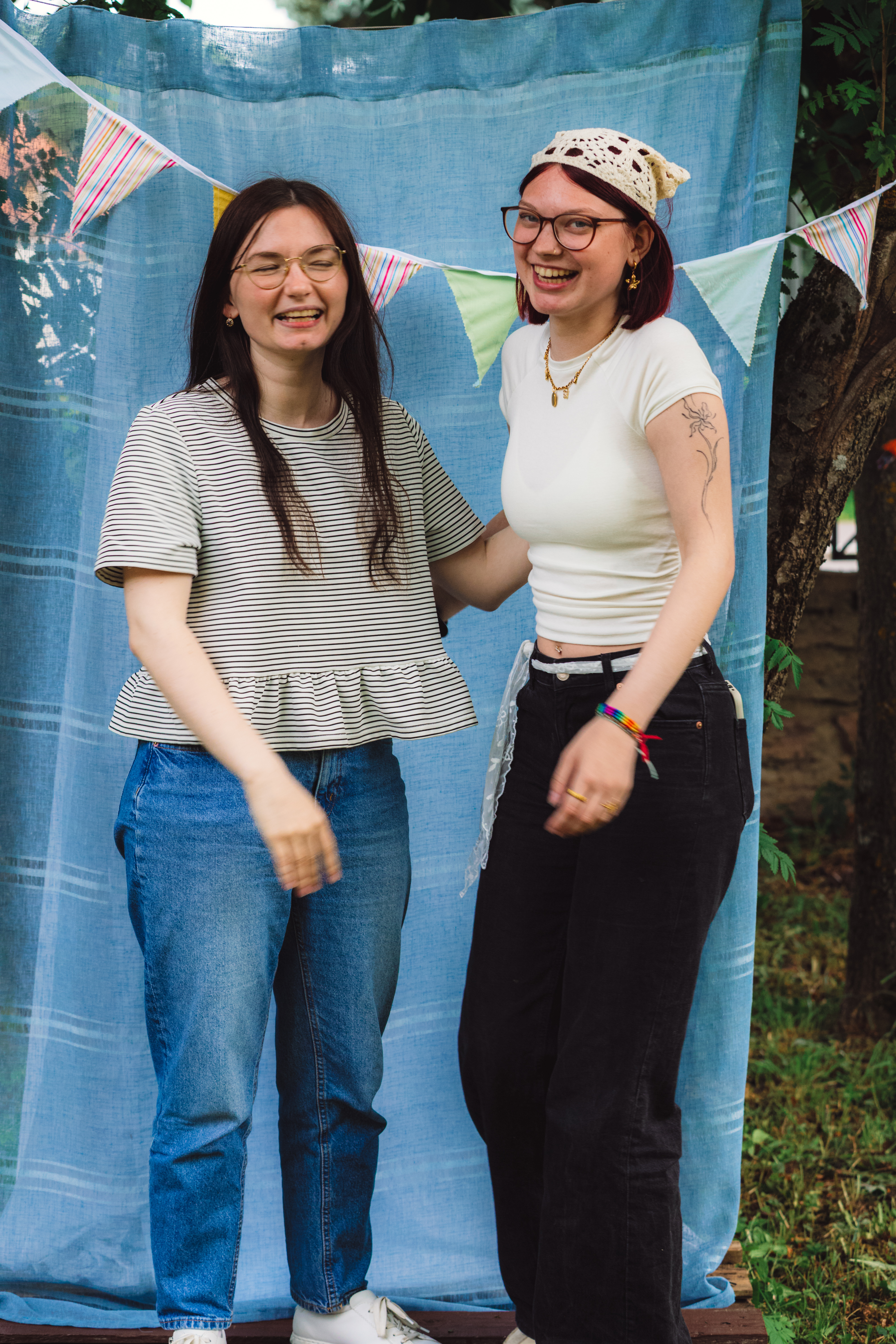 Two young people laughing together outdoors